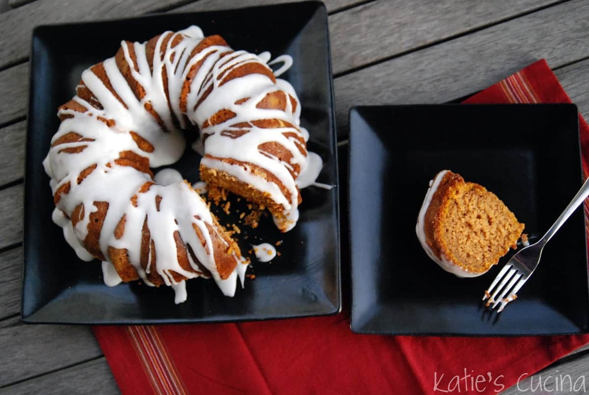 Pumpkin Spice Bundt Cake with Buttermilk Icing plated next to plate of one slice of bundt cake.