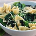 A horizontal photo with a white bowl of pasta with Snap Peas, Basil, and Spinach