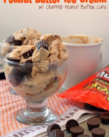 Glass bowl filled with peanut butter cups throughout and on the side of the glass.