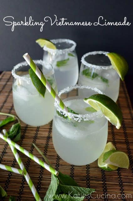 Four wine glasses filled with limeade and recipe title text on image for Pinterest.