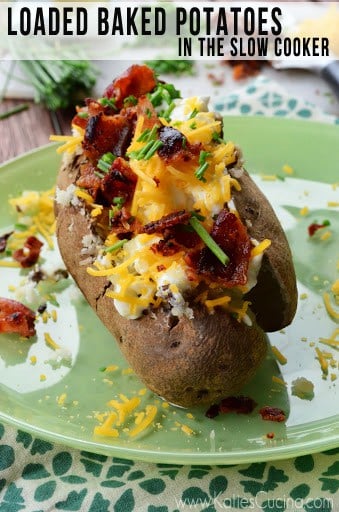 Up close photo of loaded baked potato on a green plate.