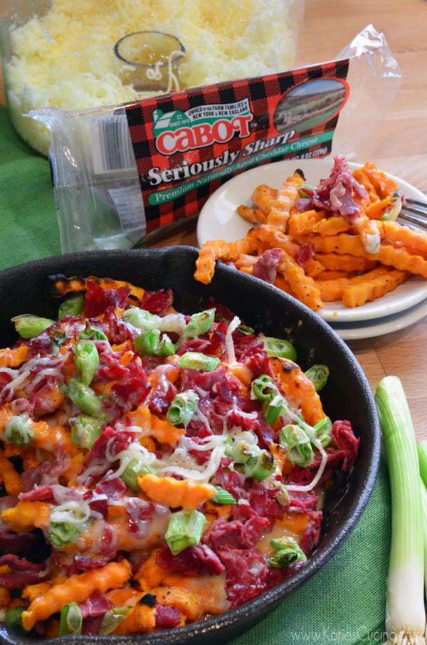 Black skillet with sweet potato fries in skillet and on a white plate.