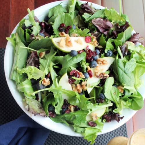 Salad greens with pears, blueberries, walnuts, and craisins.
