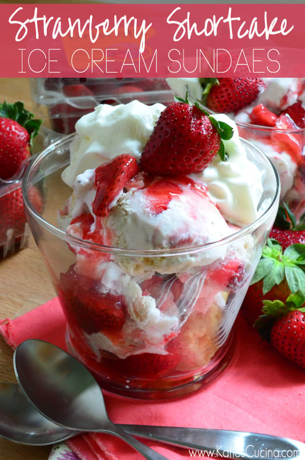 Ice Cream Sundaes in a glass bowl topped with strawberry sauce, whipped cream, and fresh strawberries. 