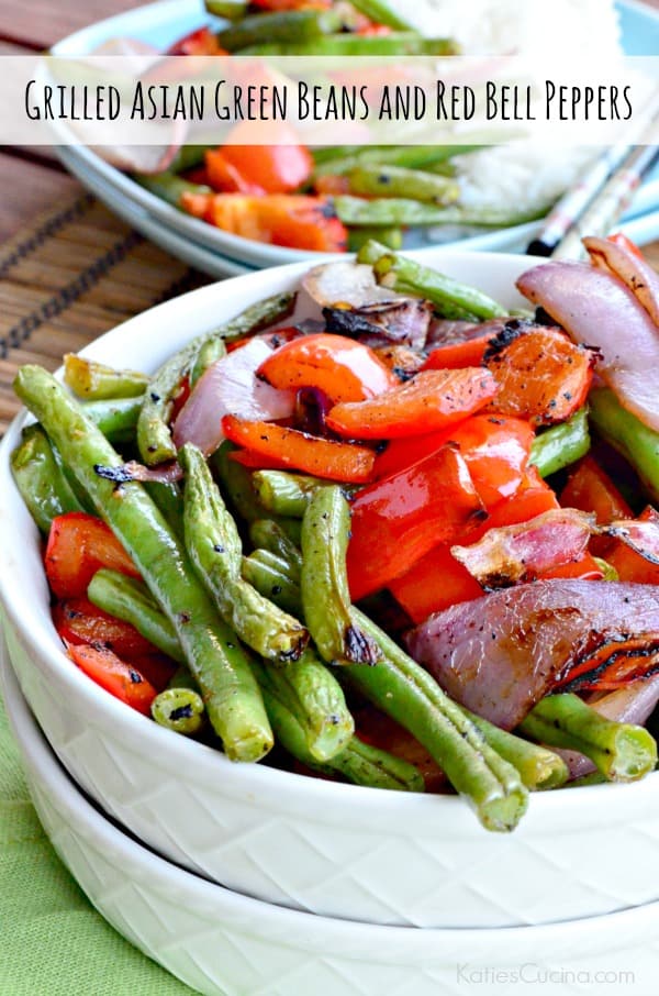 White bowl filled with grilled green beans, bell peppers, and red onions with text on image for Pinterest.