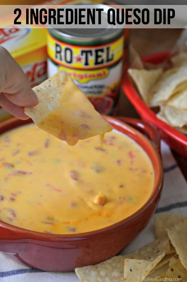 Hand holding a tortilla chip dipped in queso with a bowl of queso under it and recipe title text on image for Pinterest.