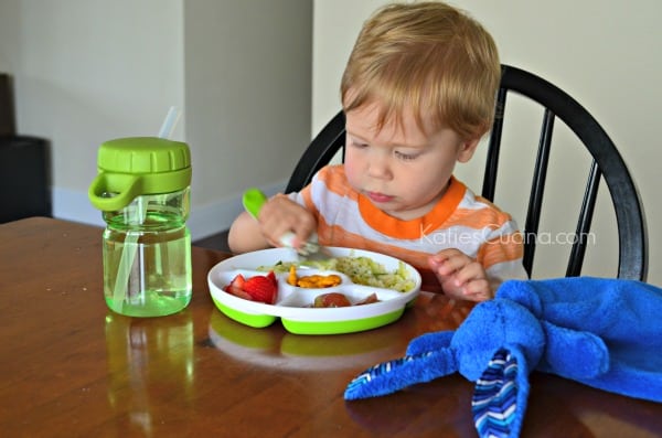 Toddler using OXO Tot feeding set