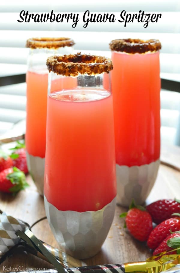 Three tall glasses with a sugar rim filled with pink drink with recipe title text on image for Pinterest.
