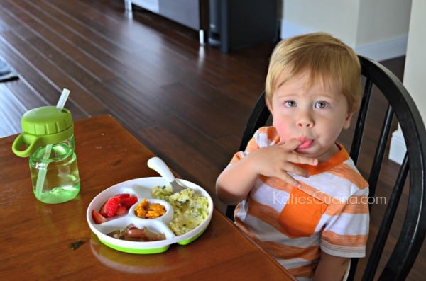 Toddler using OXO Tot feeding set