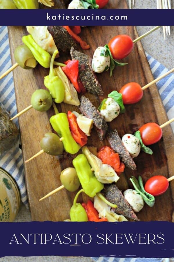 Top view of 5 Antipasto Skewers close up with text on image for Pinterest.