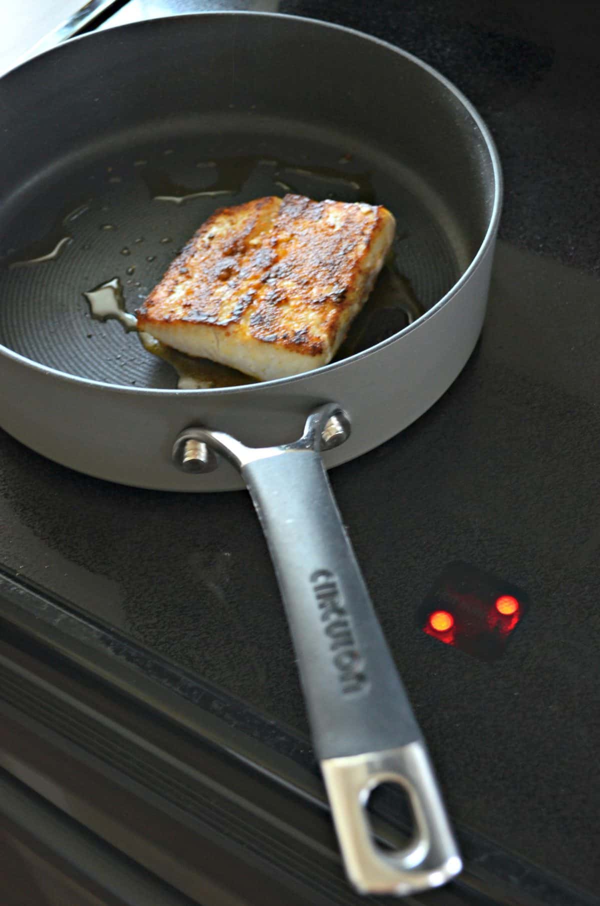 Mahi Mahi Searing in pan with oil.