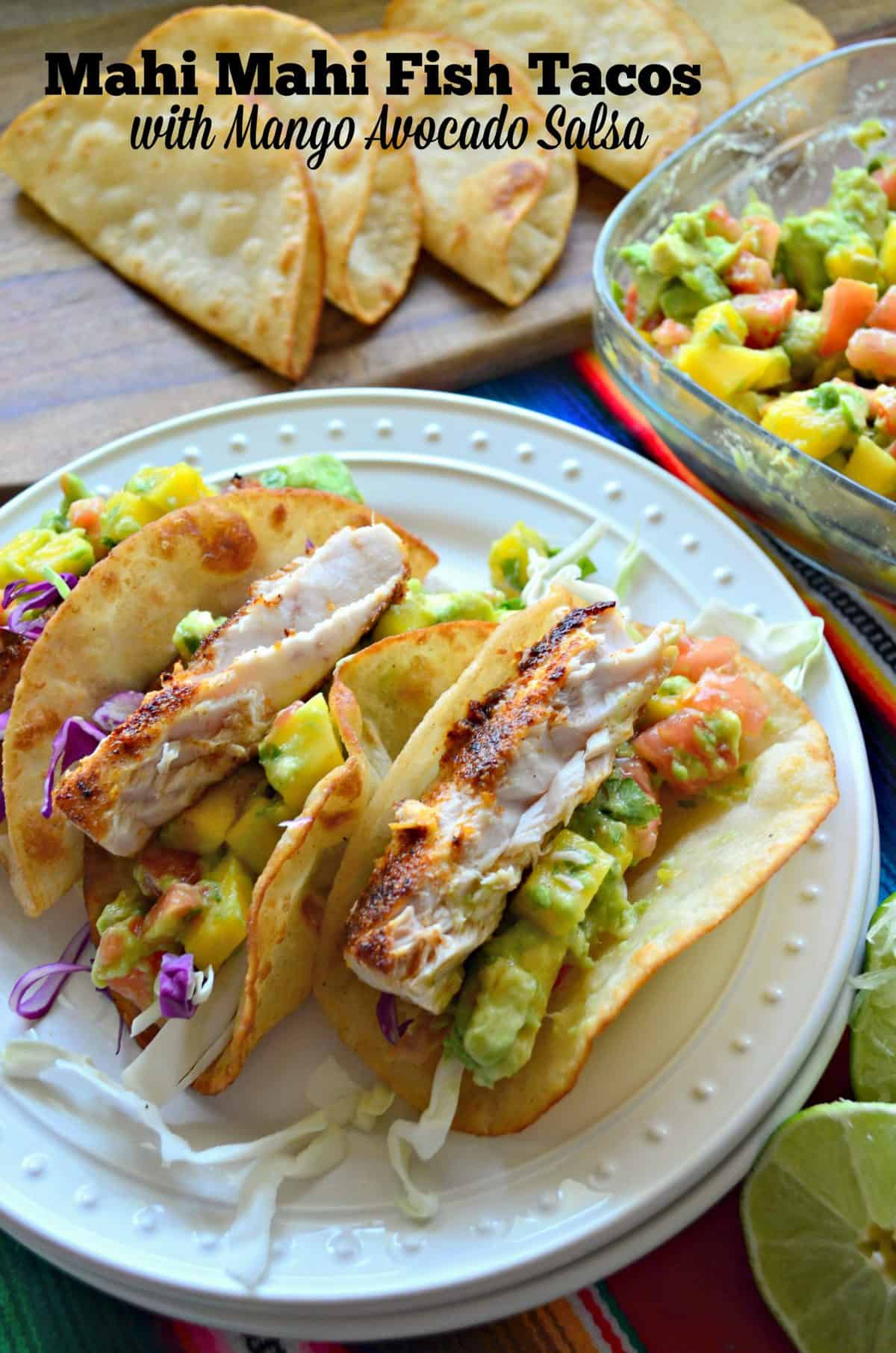 3 plated Mahi Mahi Fish Tacos with Mango Avocado Salsa and purple cabbage with title text.