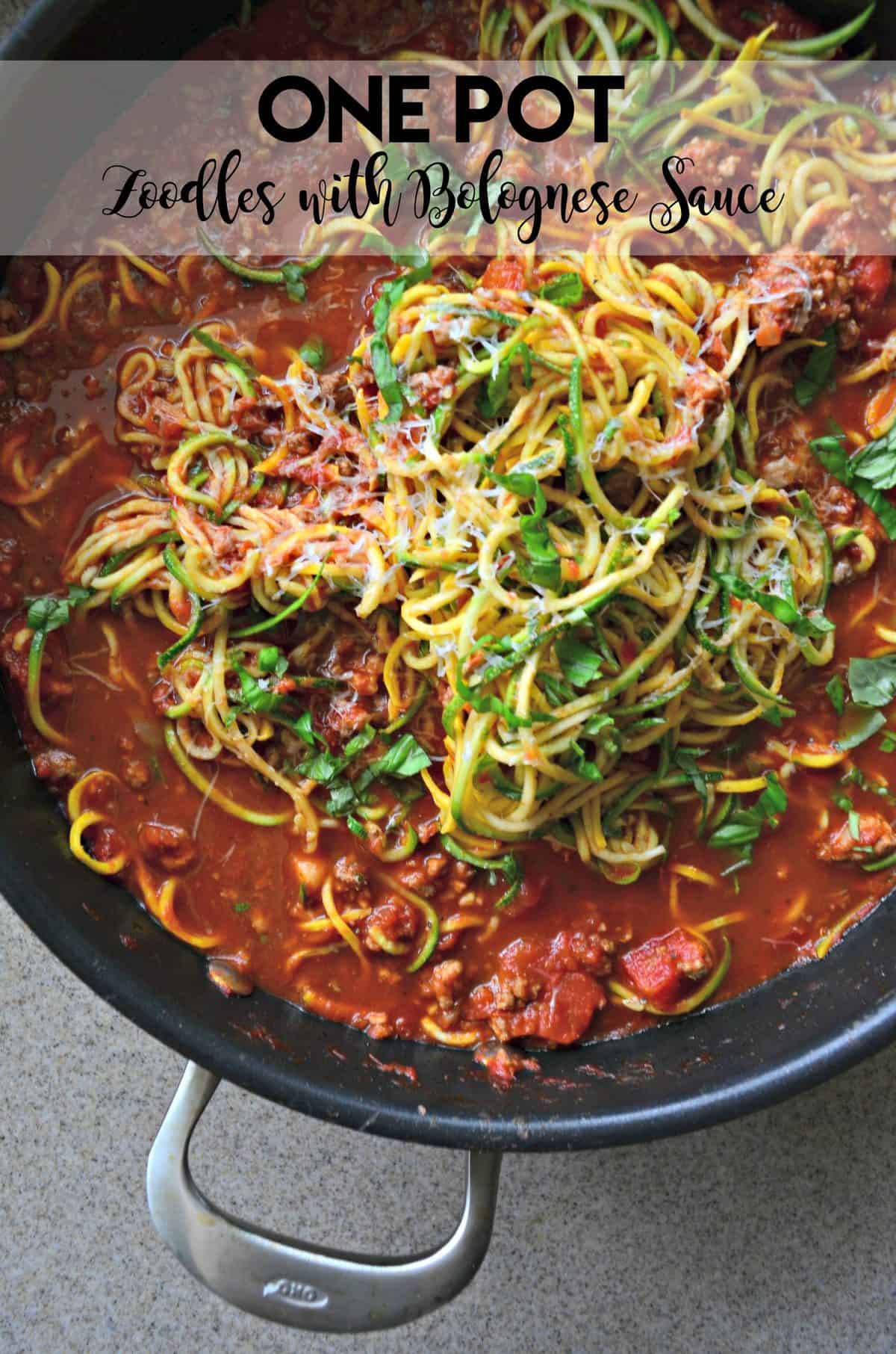 Close up of a pot of zoodles with meat sauce with text on image for Pinterest.