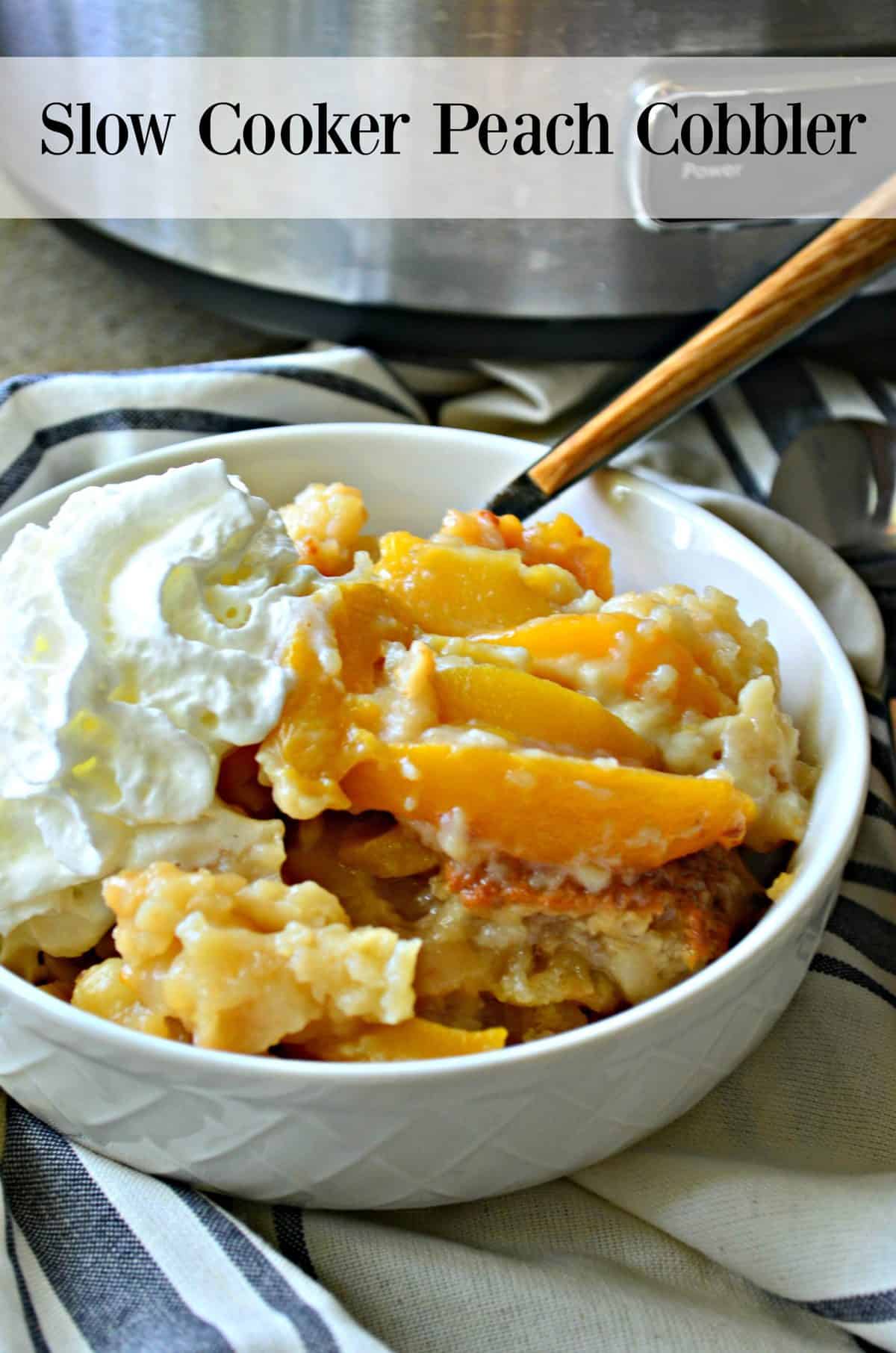 Top view of white dish filled with peach slices, whipped cream, and cobbler with title text.