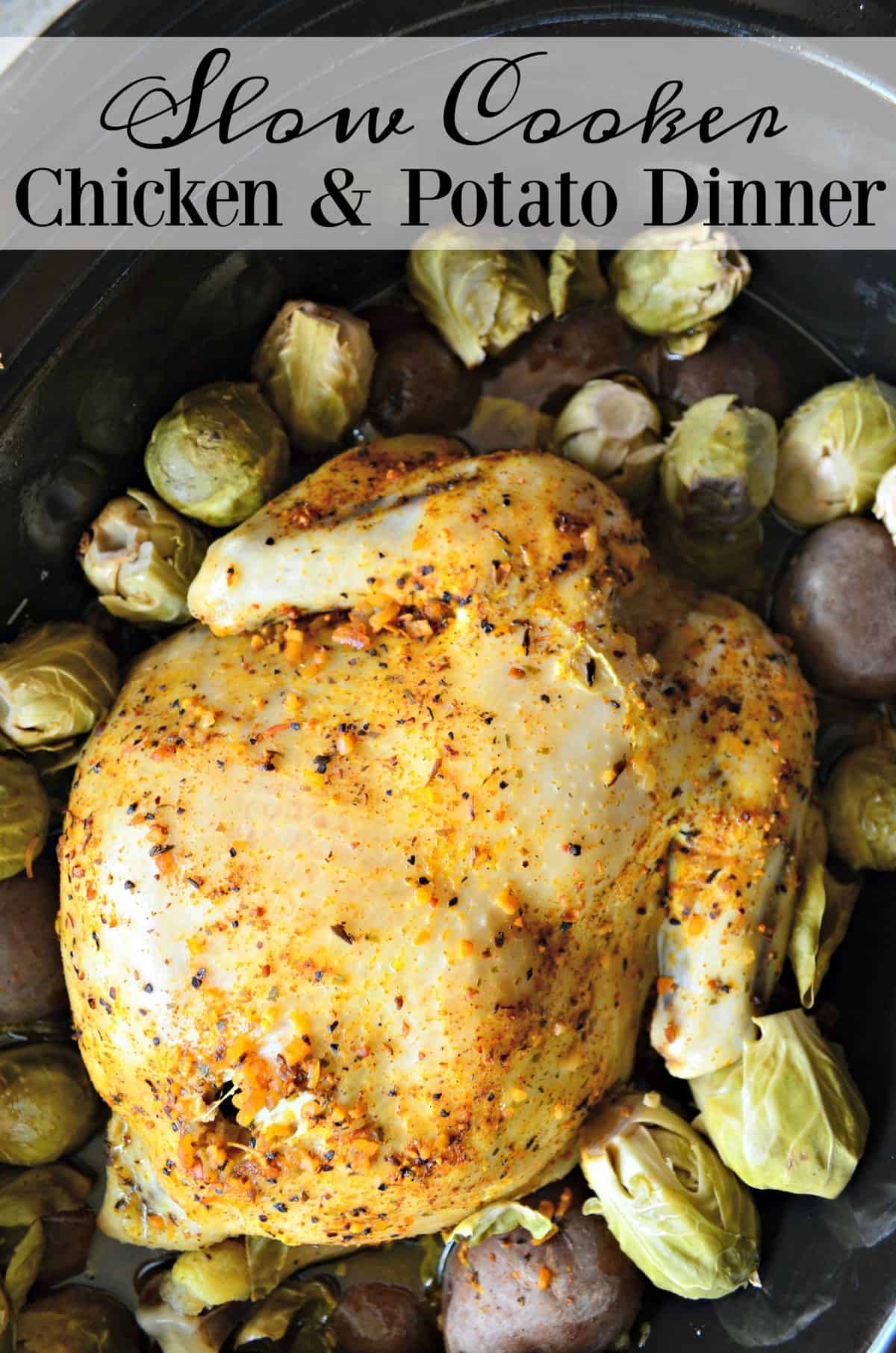 top view of Golden browned chicken topped with herbs in slow cooker with potatoes and brussels sprouts with title text.