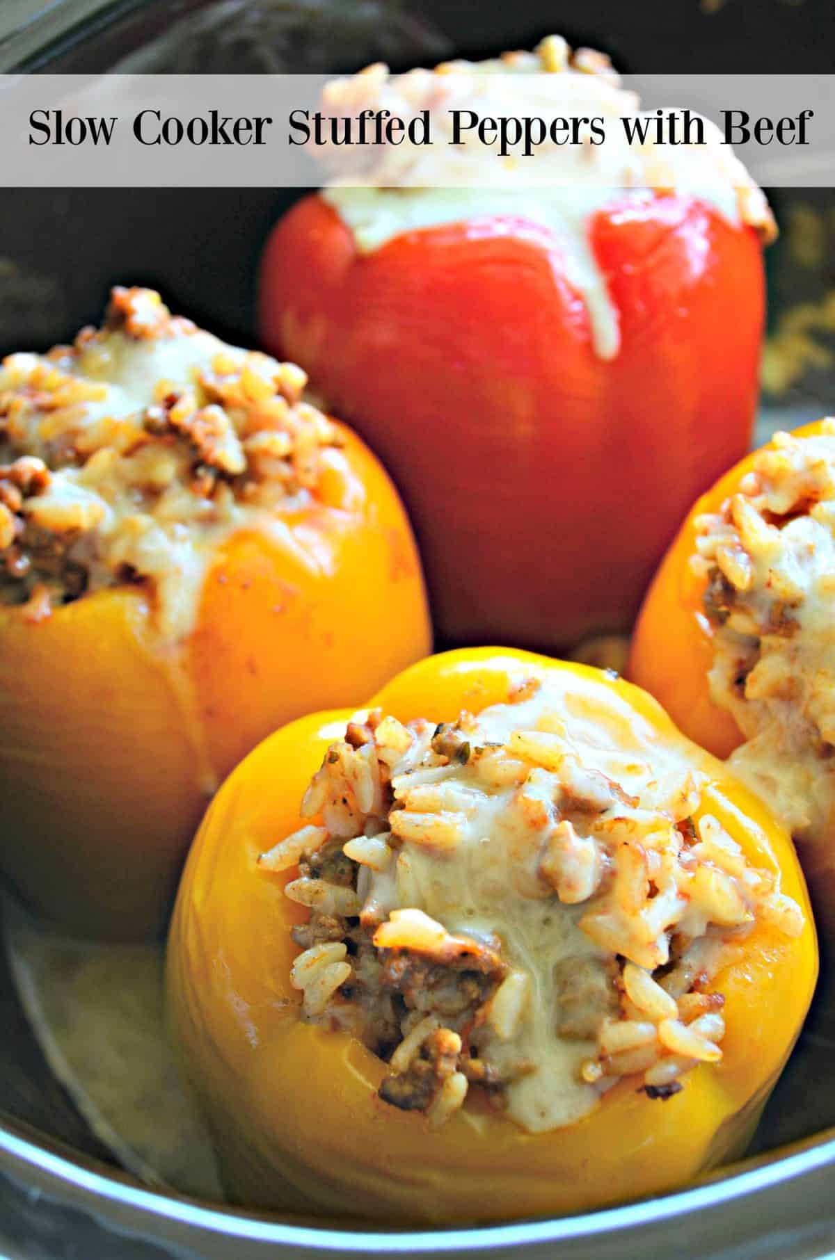 closeup of 4 bell peppers stuffed with rice and meat, topped with cheese with title text.