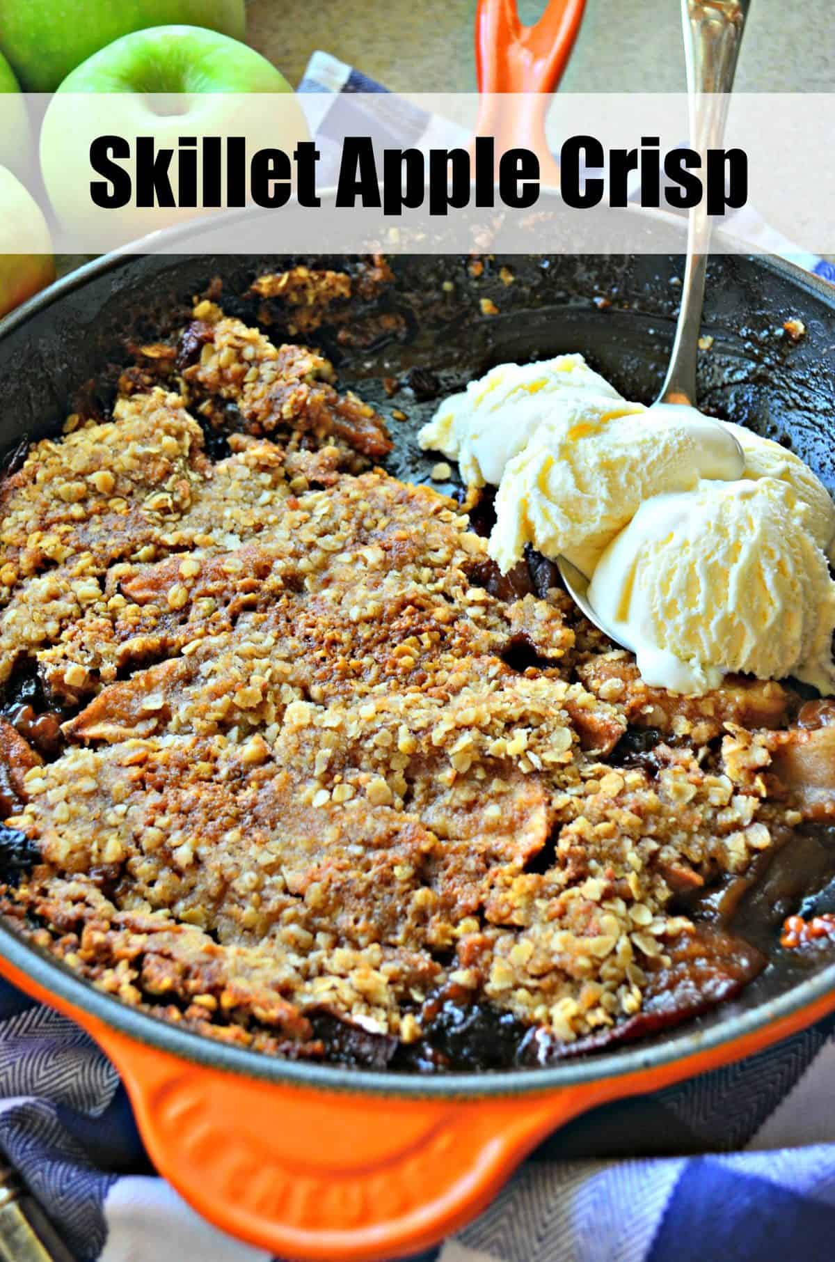 Top view of Skillet Apple Crisp in skillet with spoonful of vanilla ice cream and title text.