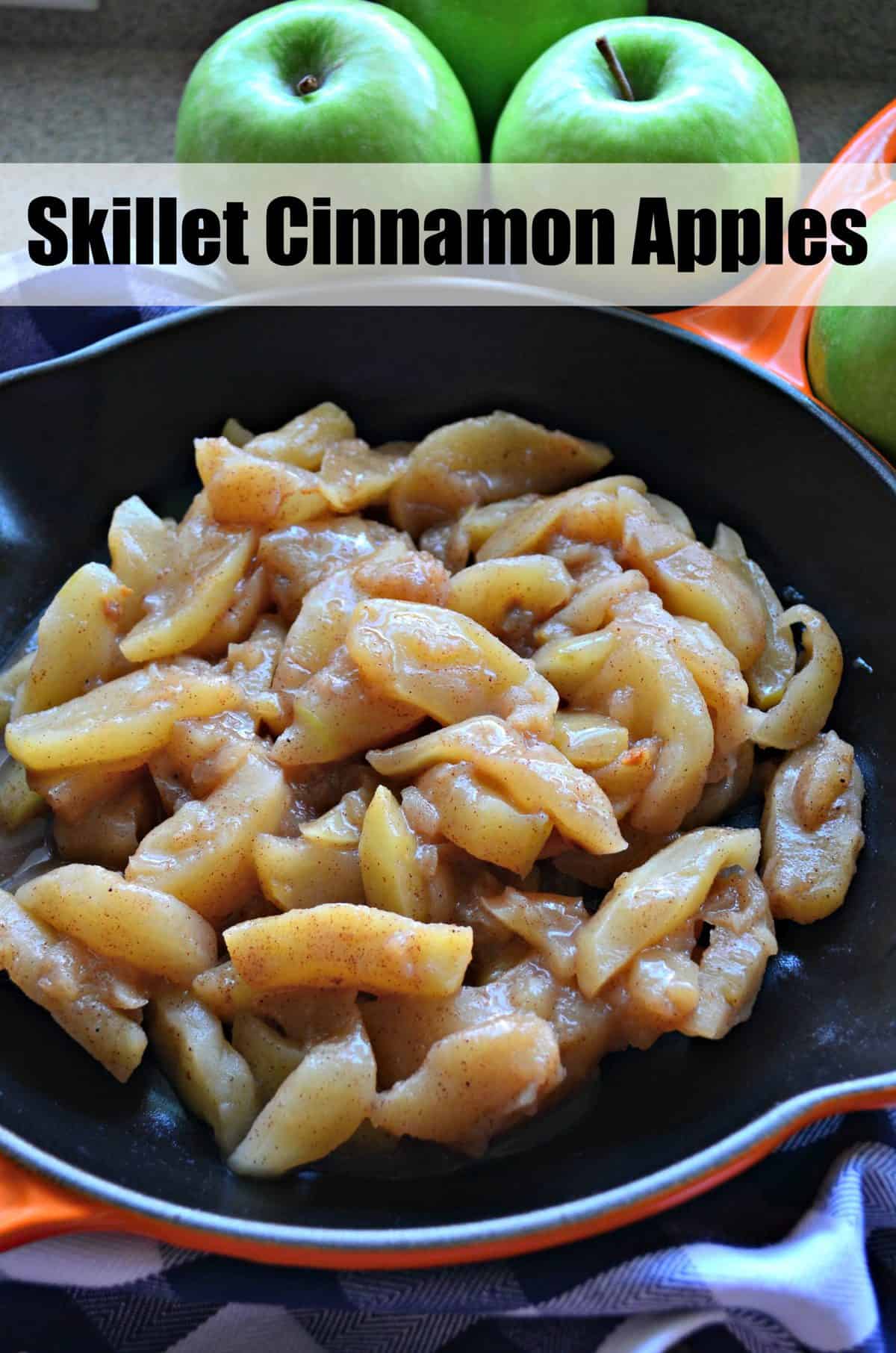Close up of an orange cast iron skillet filled with cinnamon apples with recipe title text on it for Pinterest.