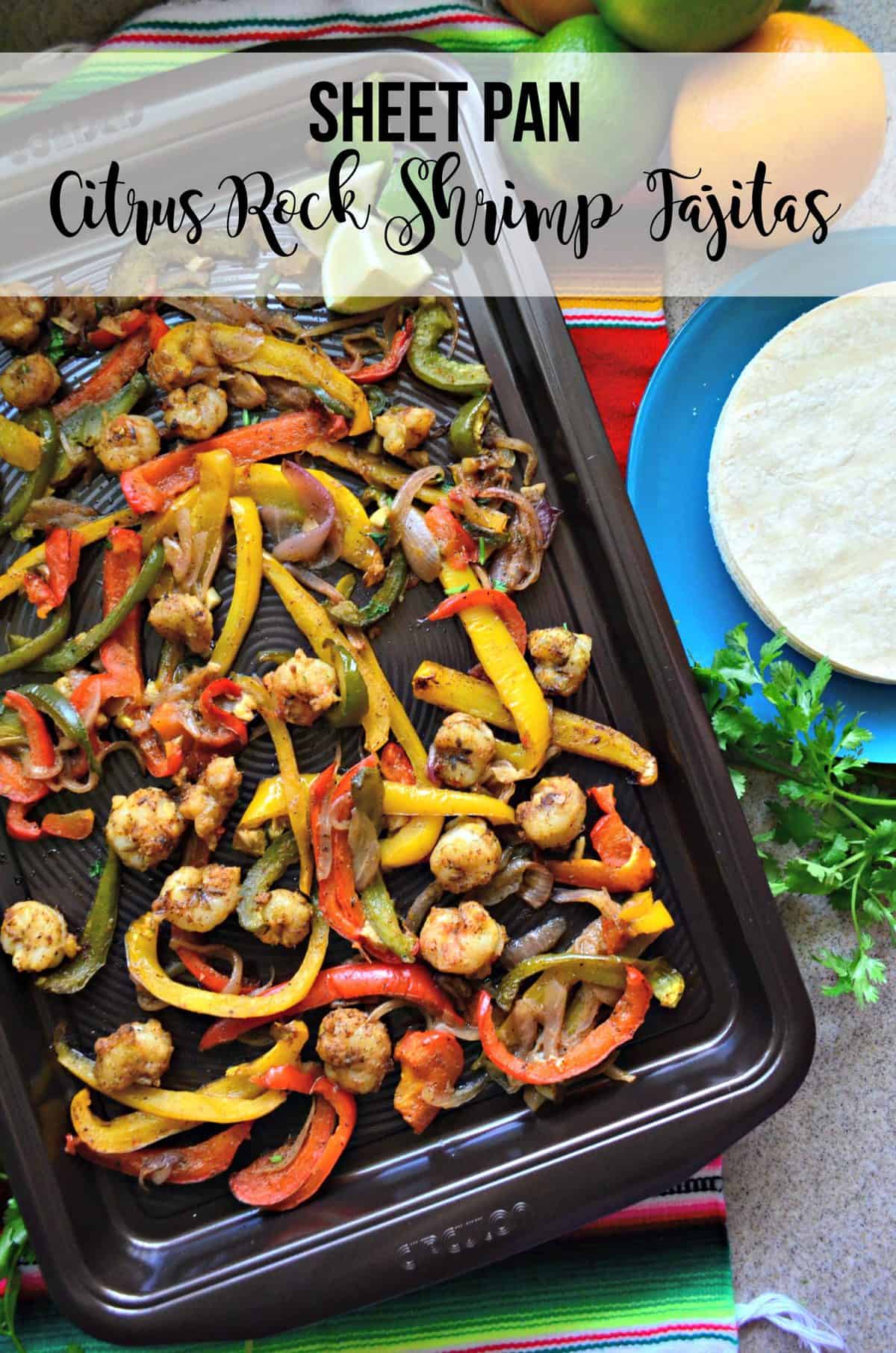 seasoned shrimp, sliced bell peppers, and onions on a sheet pan with lime and title text.