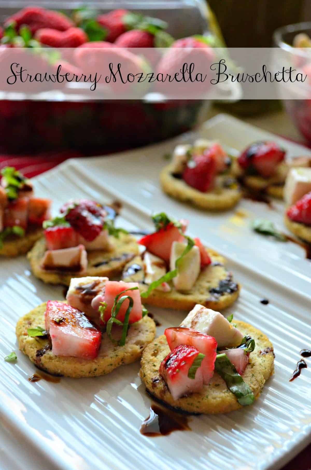 closeup of herbed crackers topped with strawberries, cheese, balsamic, and basil with title text.