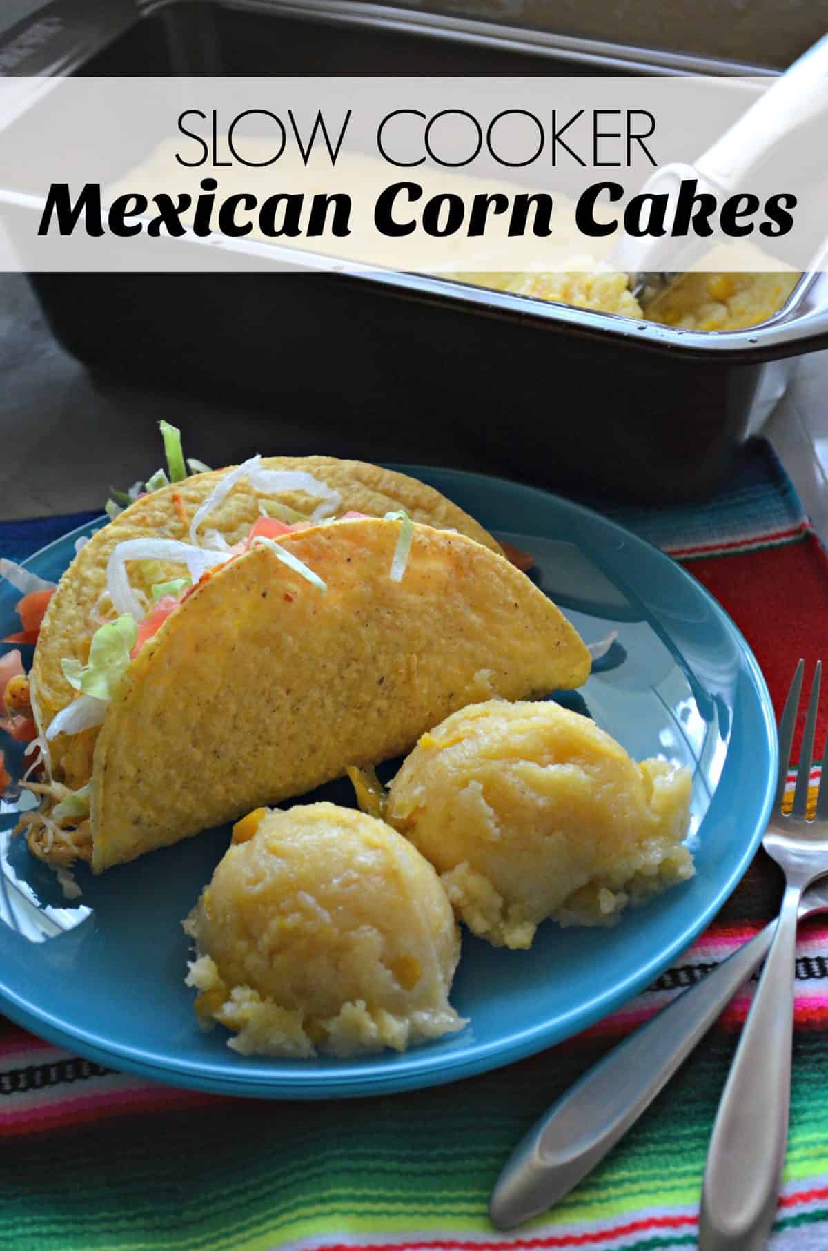 Hard shell taco with tomatoes and lettuce showing plated with two corn cakes with title text.