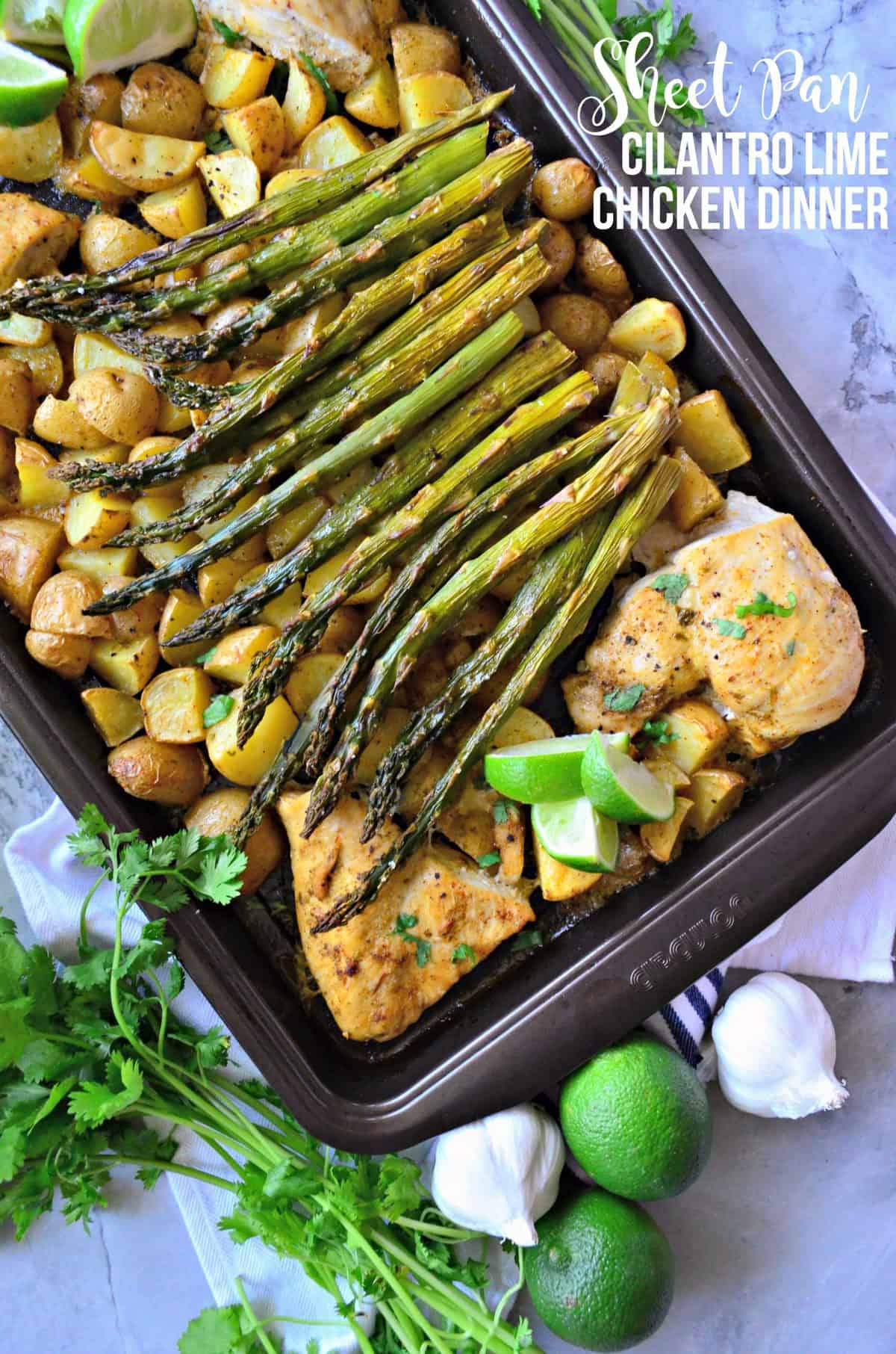 top view of pan filled with chopped potatoes, asparagus, chicken, and lime with title text.