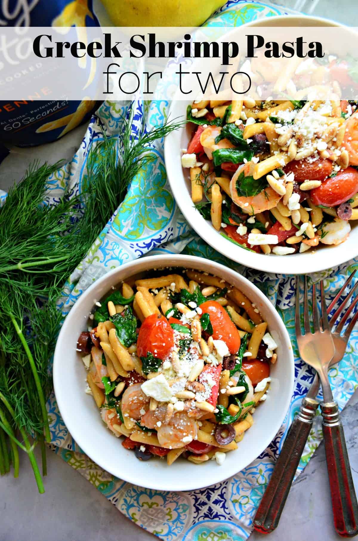 two bowls of penne with pine nuts, spinach, shrimp, tomatoes, kalamata, and cheese visible with title text.