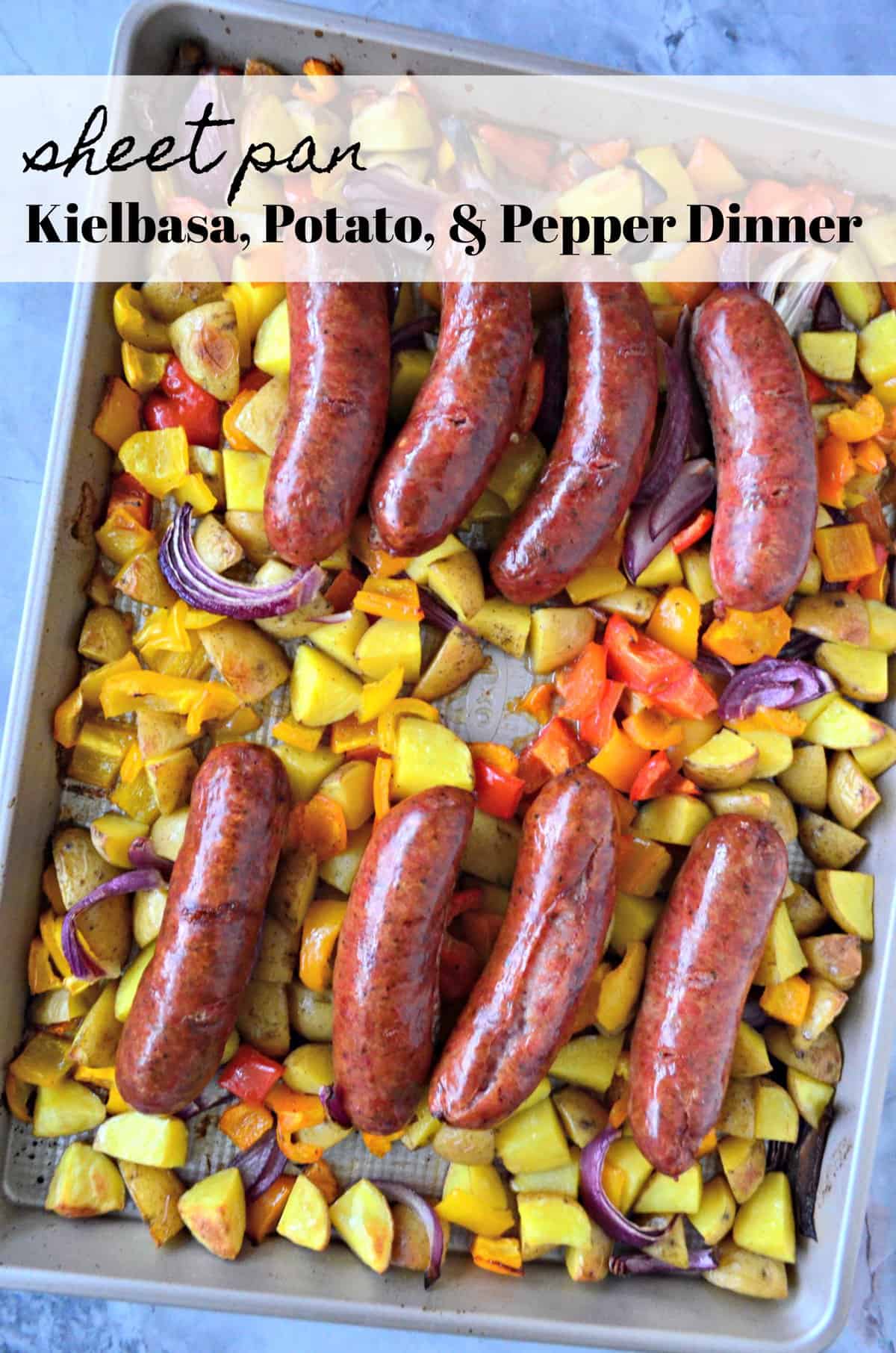 top view browned Kielbasa sausage, diced Potato, and Peppers on sheet pan with title text.