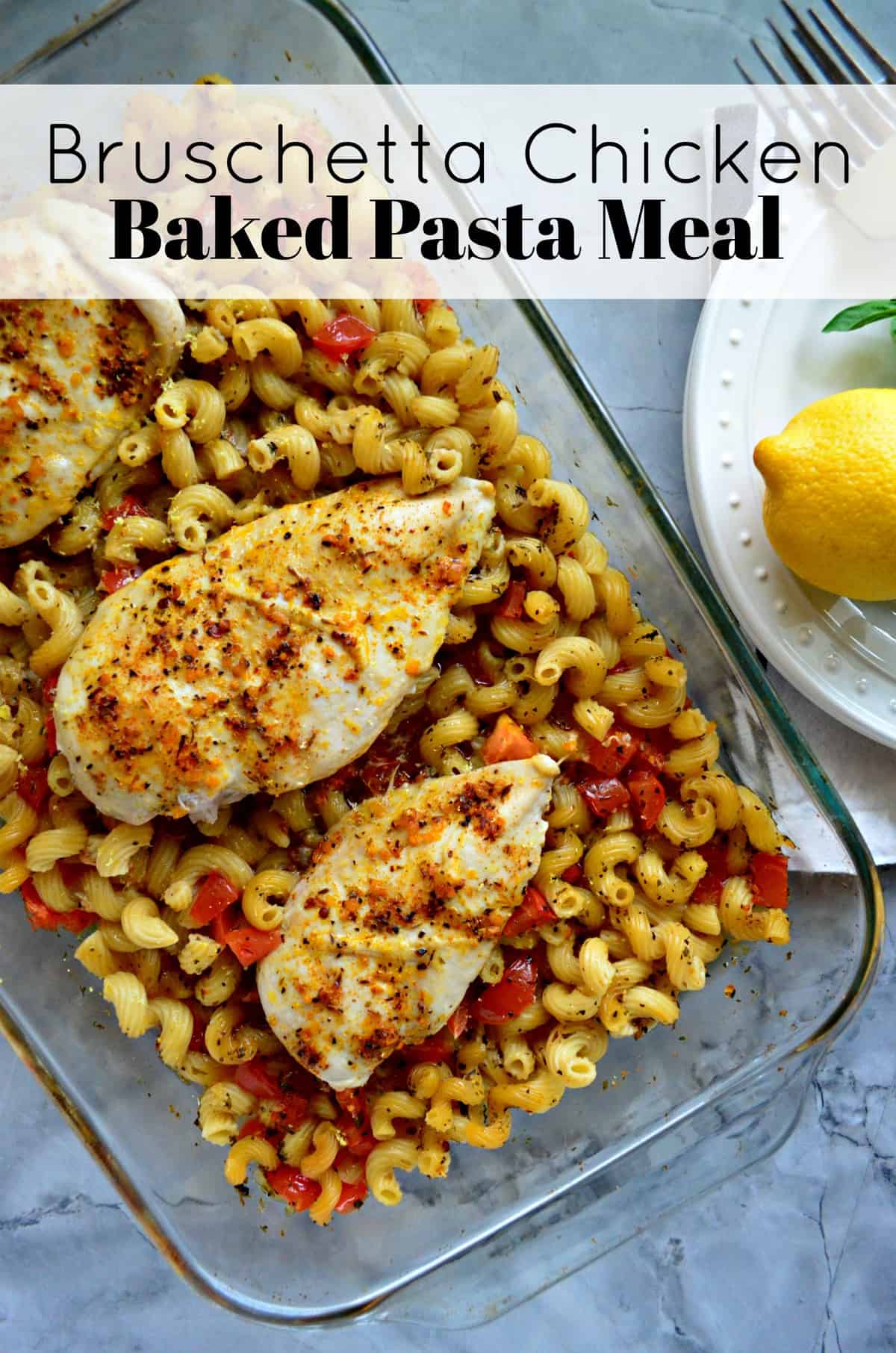 top view of glass dish with chicken breasts and cavatapi with herbs and tomatoes with title text.