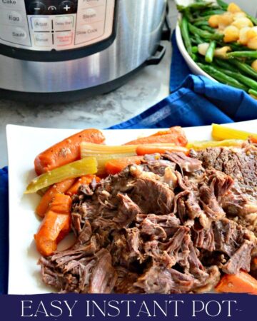 White platter filled with beef roast with carrots with text on image for Pinterest.