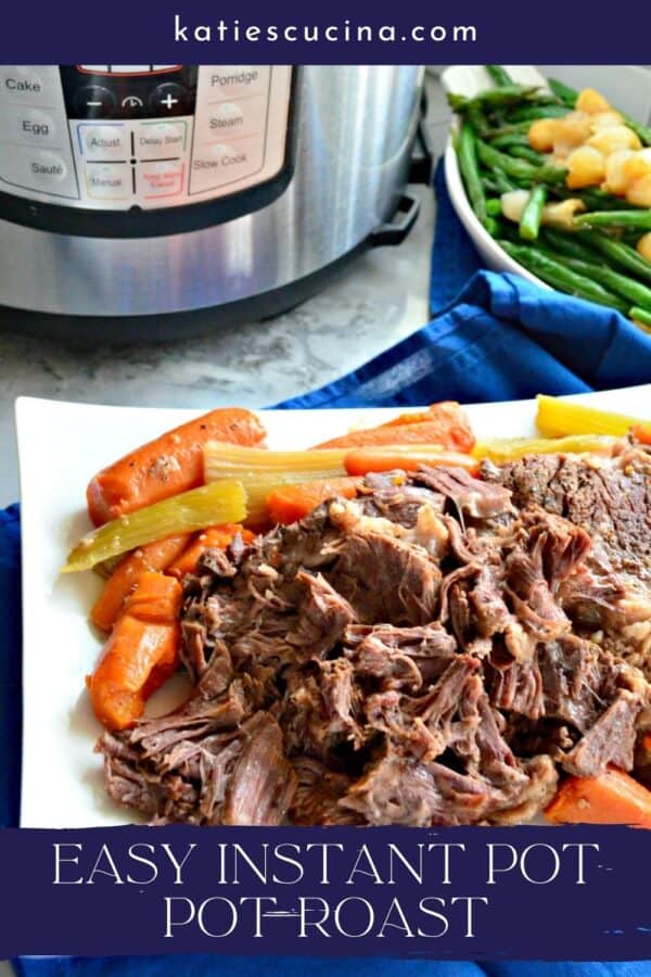 White platter filled with beef roast with carrots with text on image for Pinterest.