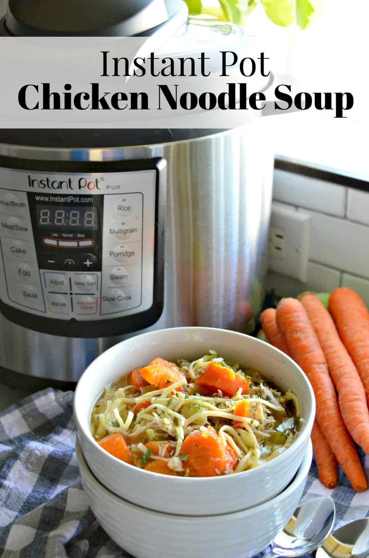 bowl of chicken noodle soup with carrots and celery in it in front of instant pot and fresh carrots.