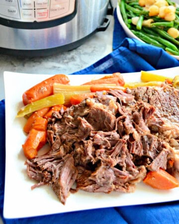 White platter filled with shredded beef, carrots, and celery.