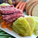 Instant Pot Corned Beef & Cabbage on a platter with rye bread on the side