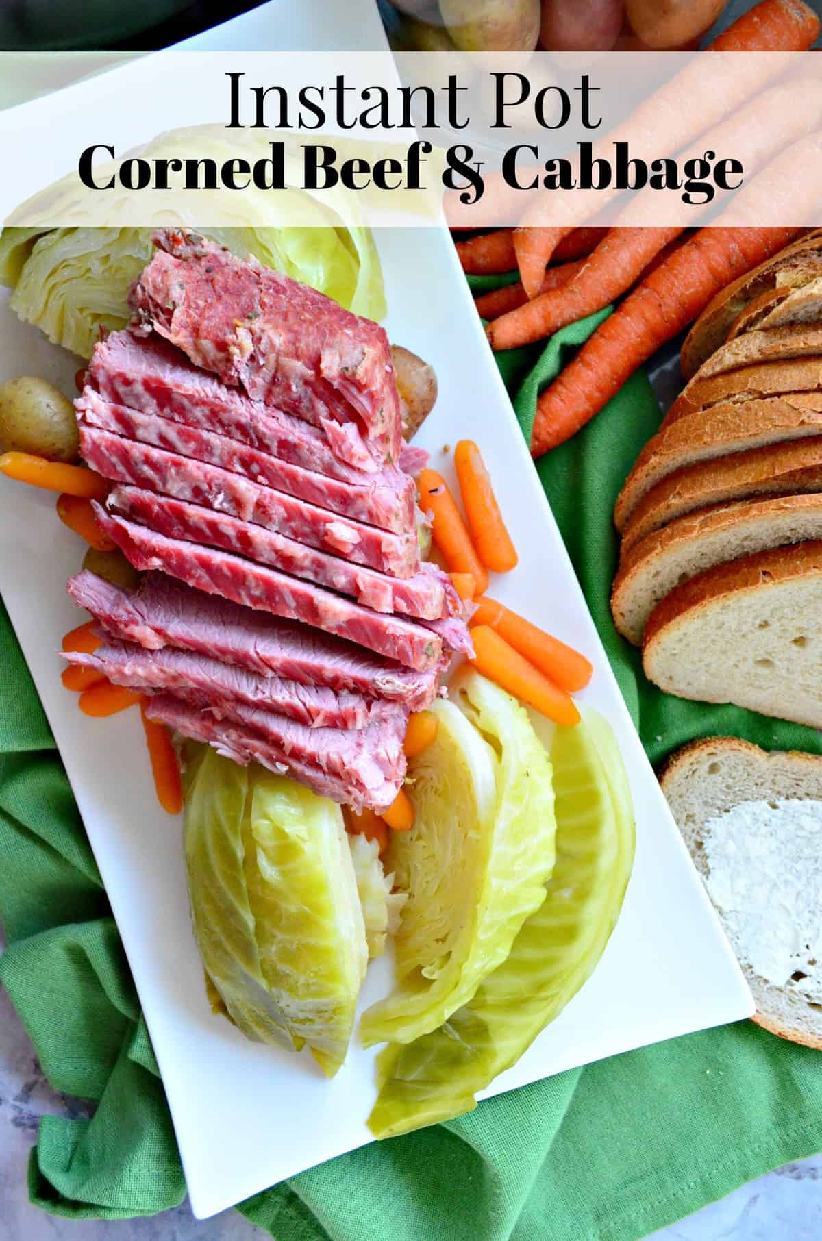 plated corned beef, cabbage, potatoes, and carrots next to sliced bread with title text.