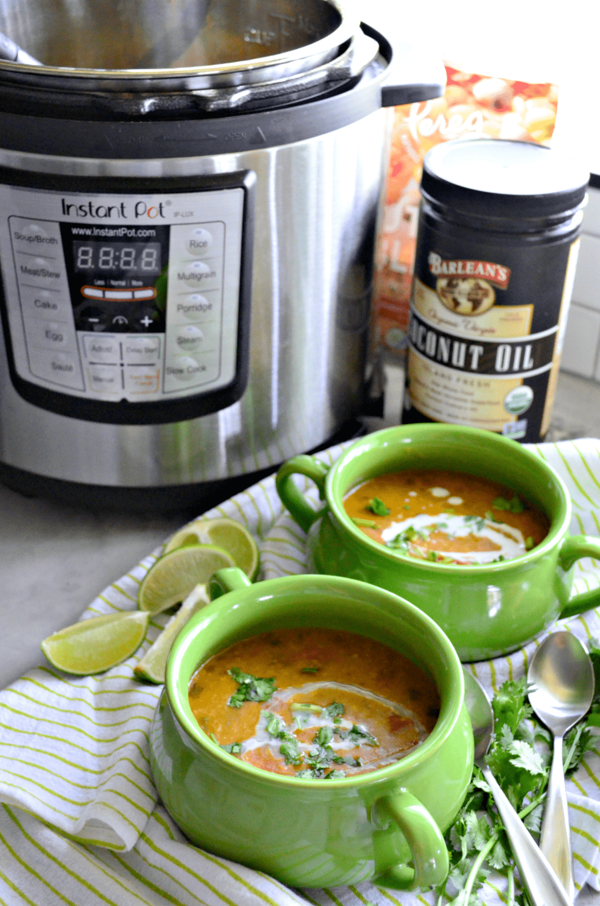 2 bowls of soup in front of instant pot and Barlean's Coconut Oil.