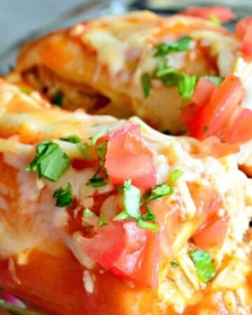 Close up of enchiladas in a baking dish with a logo on the right bottom corner.