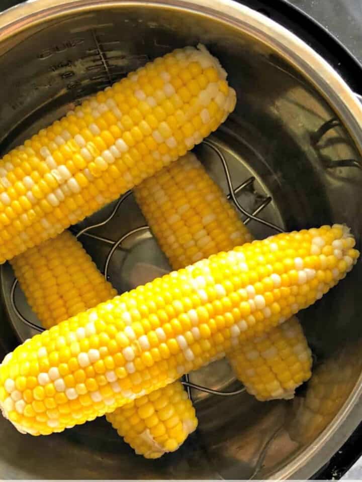 four corn on the cobs in an Instant Pot.