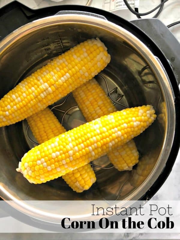 Top view of corn on the cob stacked in insta pot with pinterest title text.