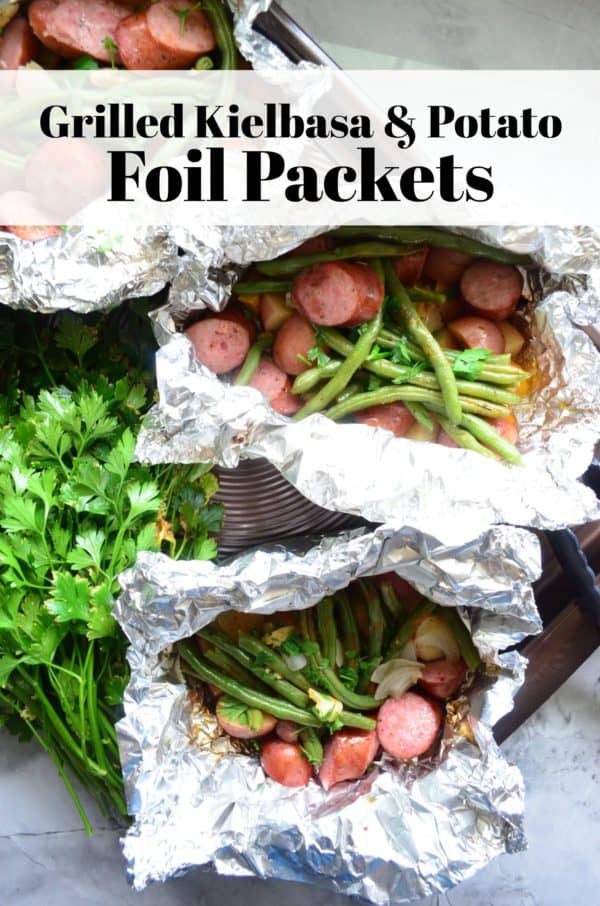 foil packets of kielbasa and green beans with pinterest title text.