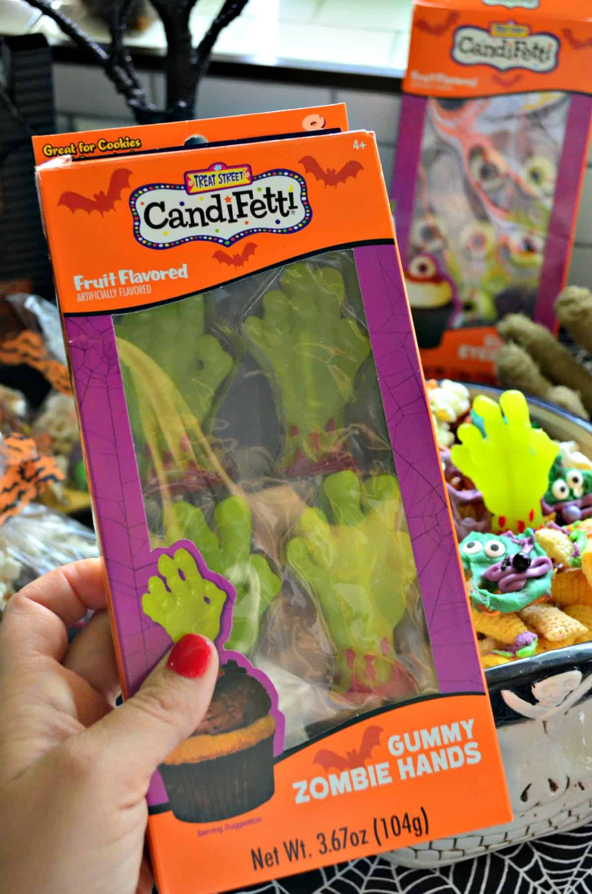 box of candifetti fruit flavored gummy zombie hands.