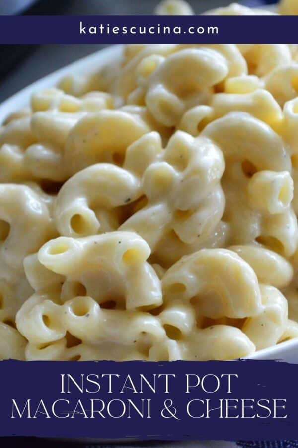 Close up of elbow macaroni's in cheese sauce with recipe title text on image for Pinterest.