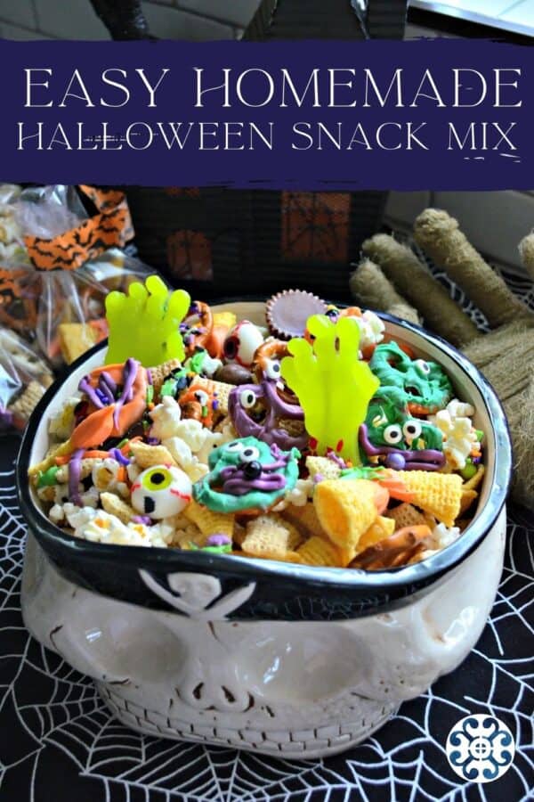 Pirate bowl filled with gummy zombie hands, bugels, popcorn, and other candy with recipe tite text on image for Pinterest.