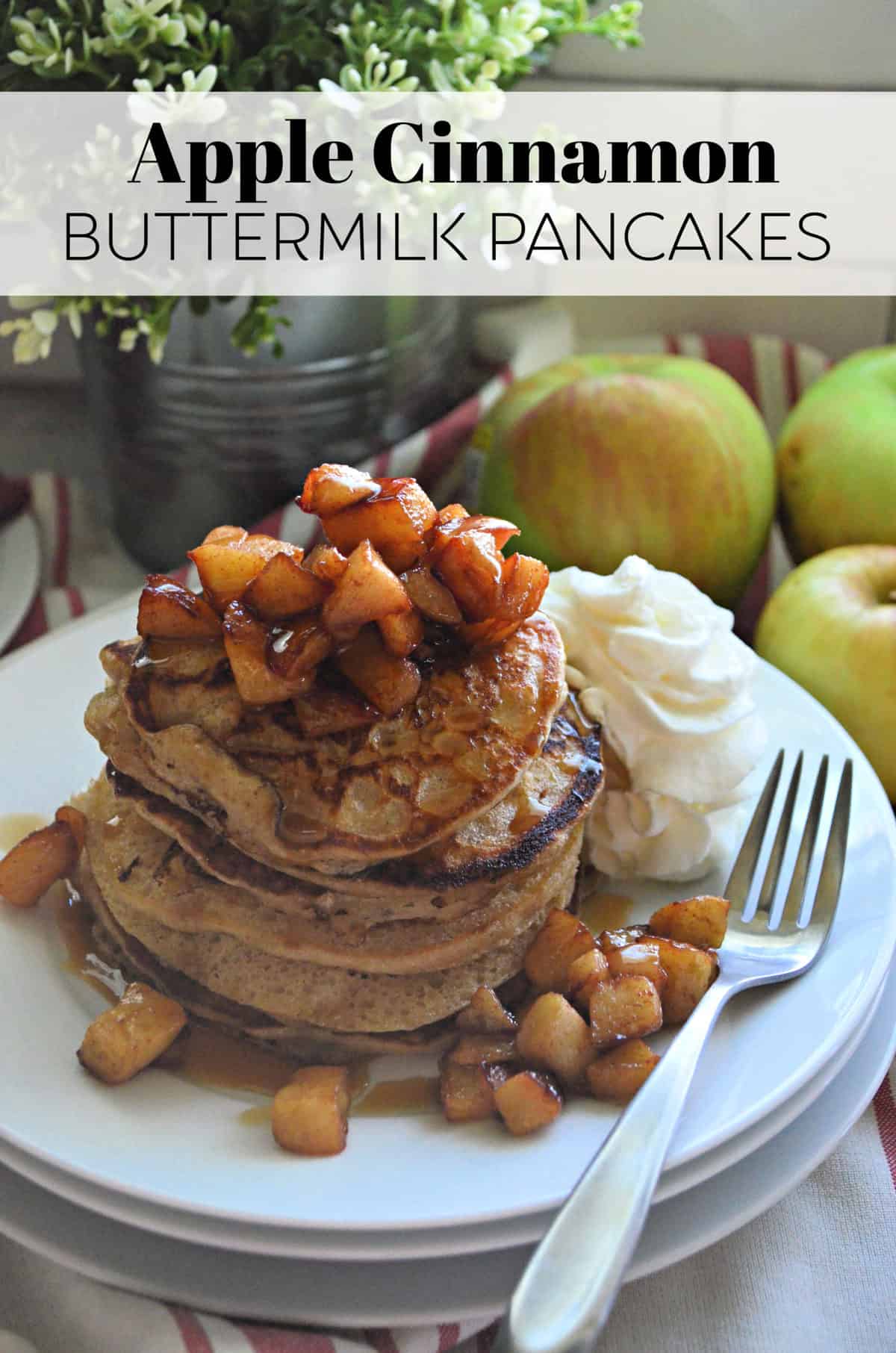 stack of cinnamon pancakes topped with apples and syrup with whipped cream next to apples.