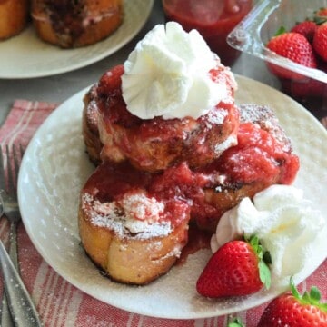 Strawberry Cream Cheese Stuffed French Toast on red striped placemat.