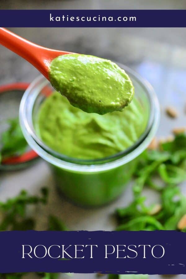 Orange spoon holding green sauce over a glass jar with text on image for Pinterst.
