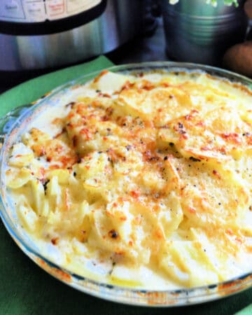 Glass pie dish with creamy potatoes.