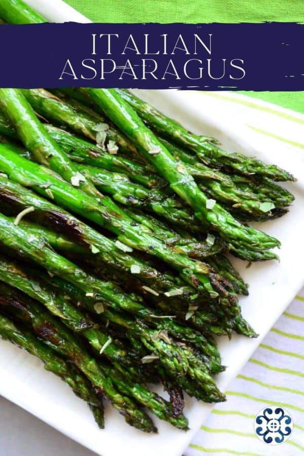 Top view of a Grilled Italian asparagus on a white plate with recipe title text on image for Pinterest.