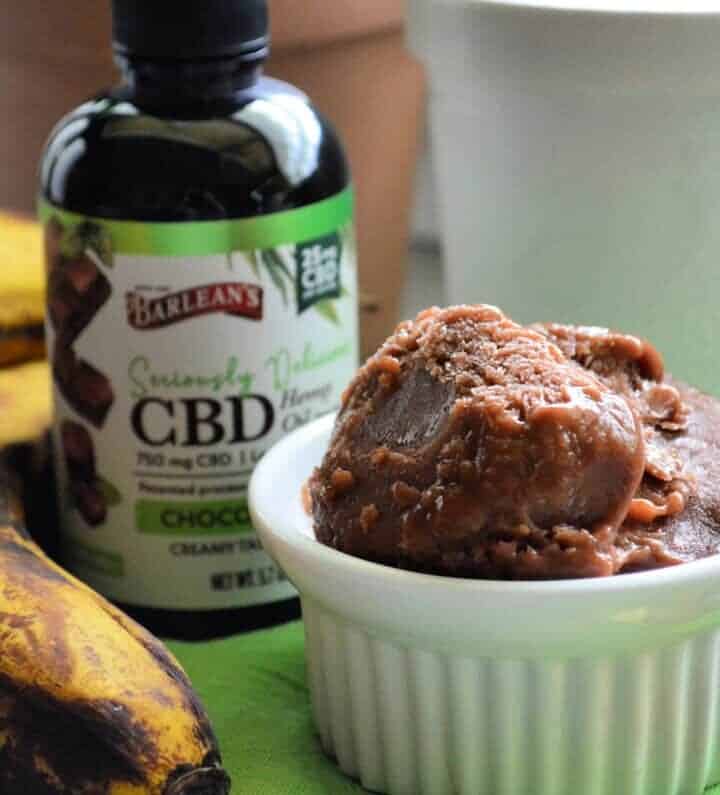 Barlean's CBD bottle next to bananas and bowl of chocolate ice cream.