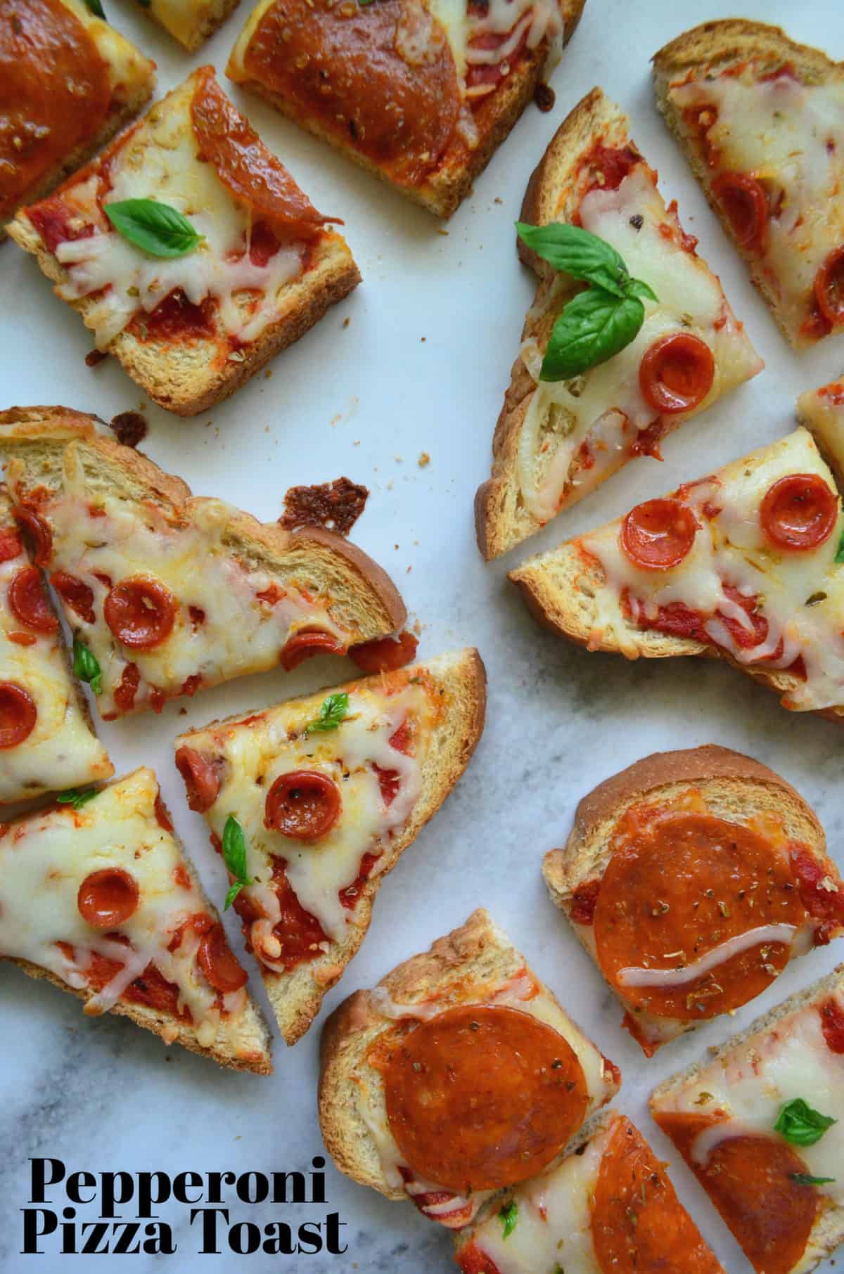 4 pieces of toast with marinara, pepperoni, and cheese, quartered on countertop with title text.